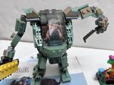 a toy robot that is on a table with other toys
