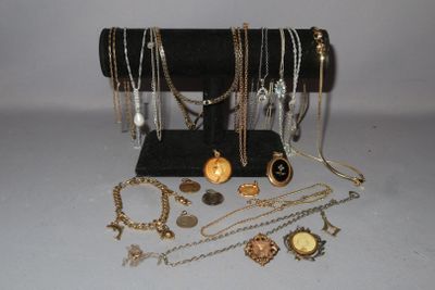 a lot of necklaces and bracelets on a table