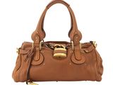 a brown leather handbag with a gold lock on the handle