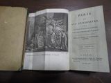 un livre ouvert sur une table, sur lequel figure un dessin