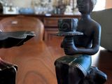 two figurines that are sitting on a table