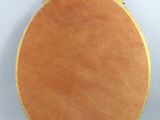 an image of a round mirror with a gold frame on a white background