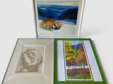 two framed pictures of a bear and a bear in a snowy landscape