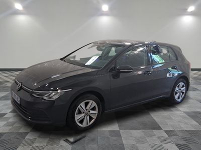 the volkswagen golf is parked in a garage with a checkered floor