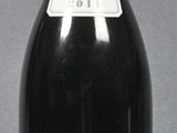 a bottle of wine that is sitting on a table