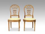 pair of antique chairs with cane backrests and cane backrests