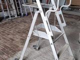 a ladder that is sitting on the floor in a room
