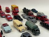 a lot of toy cars that are on the table