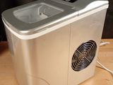 an image of a portable ice maker on a wooden table