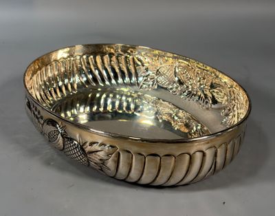 a silver bowl that is sitting on a table
