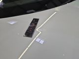 a remote control on the hood of a sports car