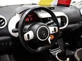 a car dashboard with a steering wheel and a phone holder
