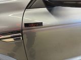 a close up of a car door handle with a sticker on it