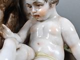 a figurine of a boy and a dog on a table