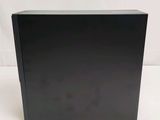 an image of a black box sitting on top of a white surface