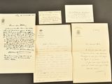 several old letters are sitting on top of each other on a table