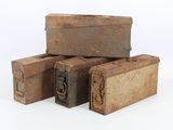 three old suitcases sitting next to each other on a white surface