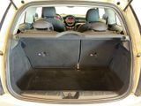 the back of a car with the trunk open and the seats folded down