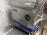 a machine that is wrapped in plastic in a kitchen