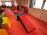 a room that has a lot of colorful mats on the floor