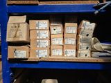 a blue shelf filled with boxes and papers on top of it