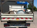 an image of a flatbed truck parked in a parking lot