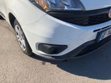 a white van parked on the side of the road