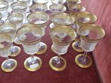a lot of wine glasses sitting on a table
