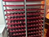 a rack with many trays of food on it