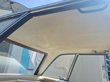 a view of the inside of a car from the driver ' s seat