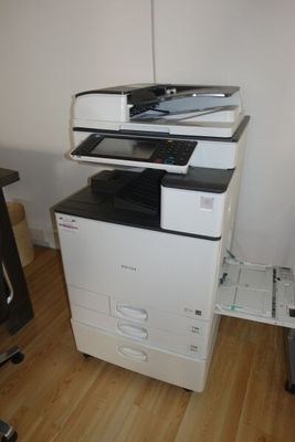 a white printer sitting on top of a black and white printer