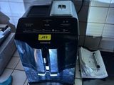 a coffee maker sitting on a counter in a kitchen