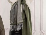a mannequin in front of a mannequin wearing a scarf