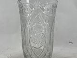 an image of a glass vase on a white surface
