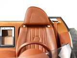 a brown leather car with a steering wheel and dashboard