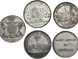 six different types of silver coins are shown on a white background