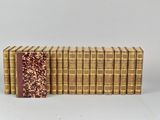 a stack of books sitting on top of each other next to each other