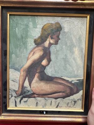 tableau représentant une femme nue assise sur un rocher, dans un cadre