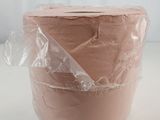 a cake that is wrapped in plastic and sitting on a table