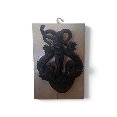 a picture of a wall mounted sculpture of a man and a woman