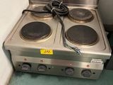 two burners on the stove in the corner of the room