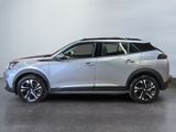 a silver nissan suv is parked in a garage