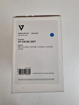 a box of blue ink sitting on top of a white table
