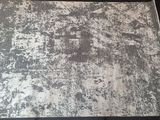 a black and white rug on a black table