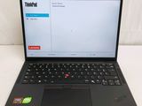 a laptop that is sitting on a white surface
