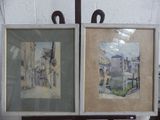 deux tableaux accrochés au mur d'une pièce