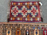 a close up of two rugs on the ground with one rug on the ground