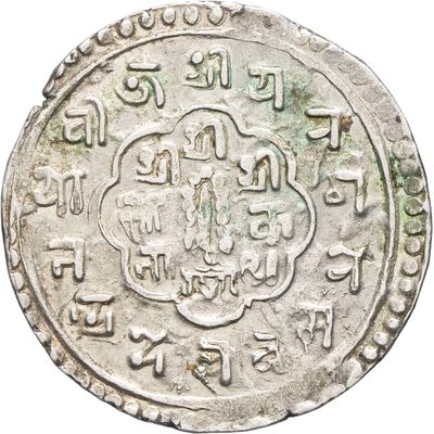 un gros plan d'une pièce d'argent sur laquelle figure une inscription