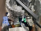 a cardboard box filled with assorted items in it