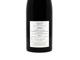 a bottle of wine that is sitting on a table